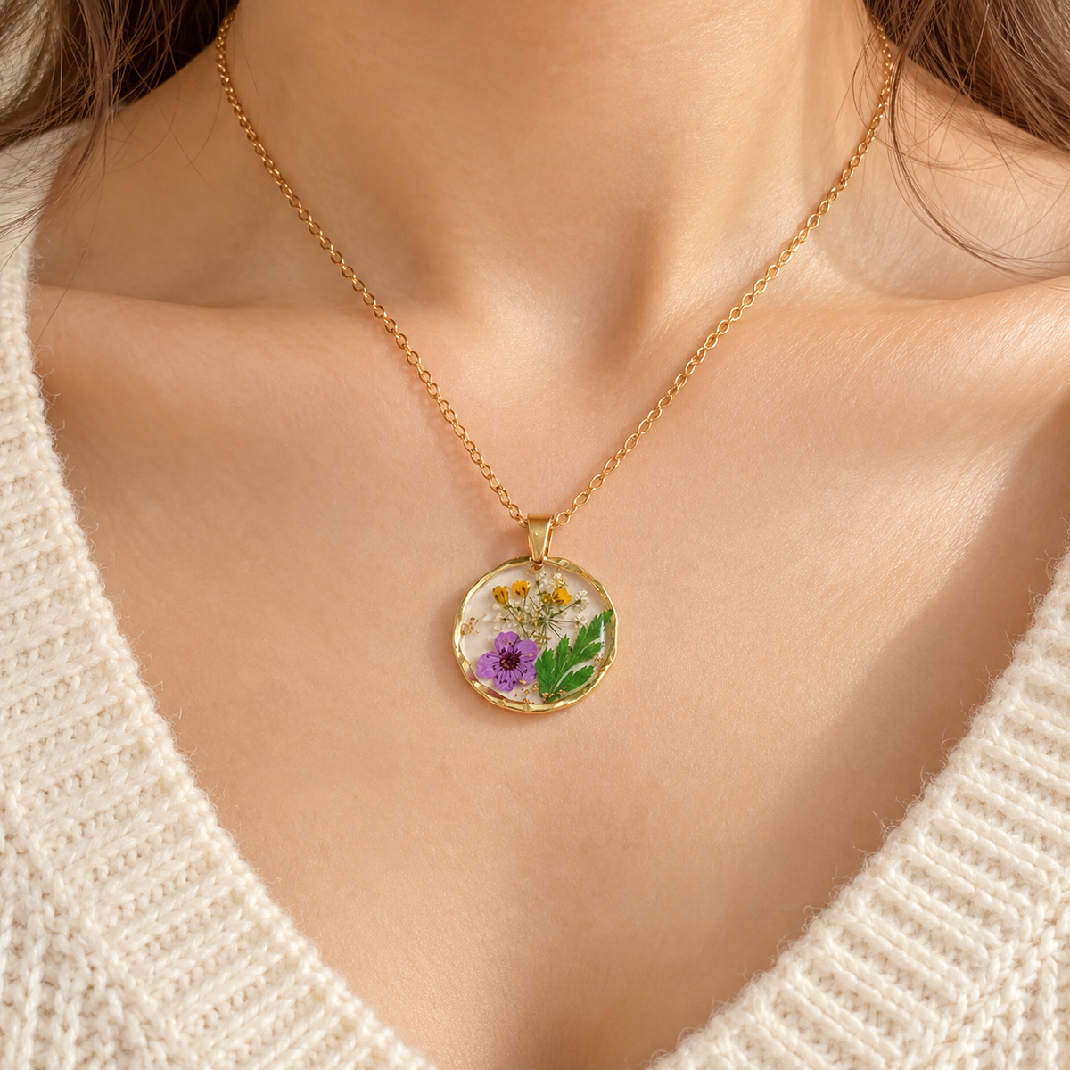 Pressed flower resin necklace worn on model