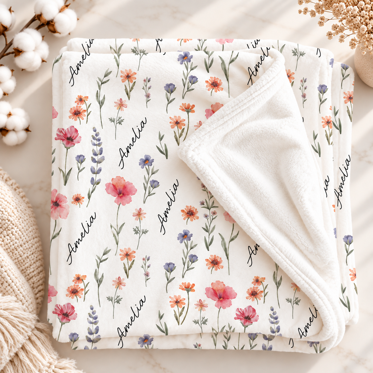 Folded personalized wildflower minky baby blanket with soft white reverse