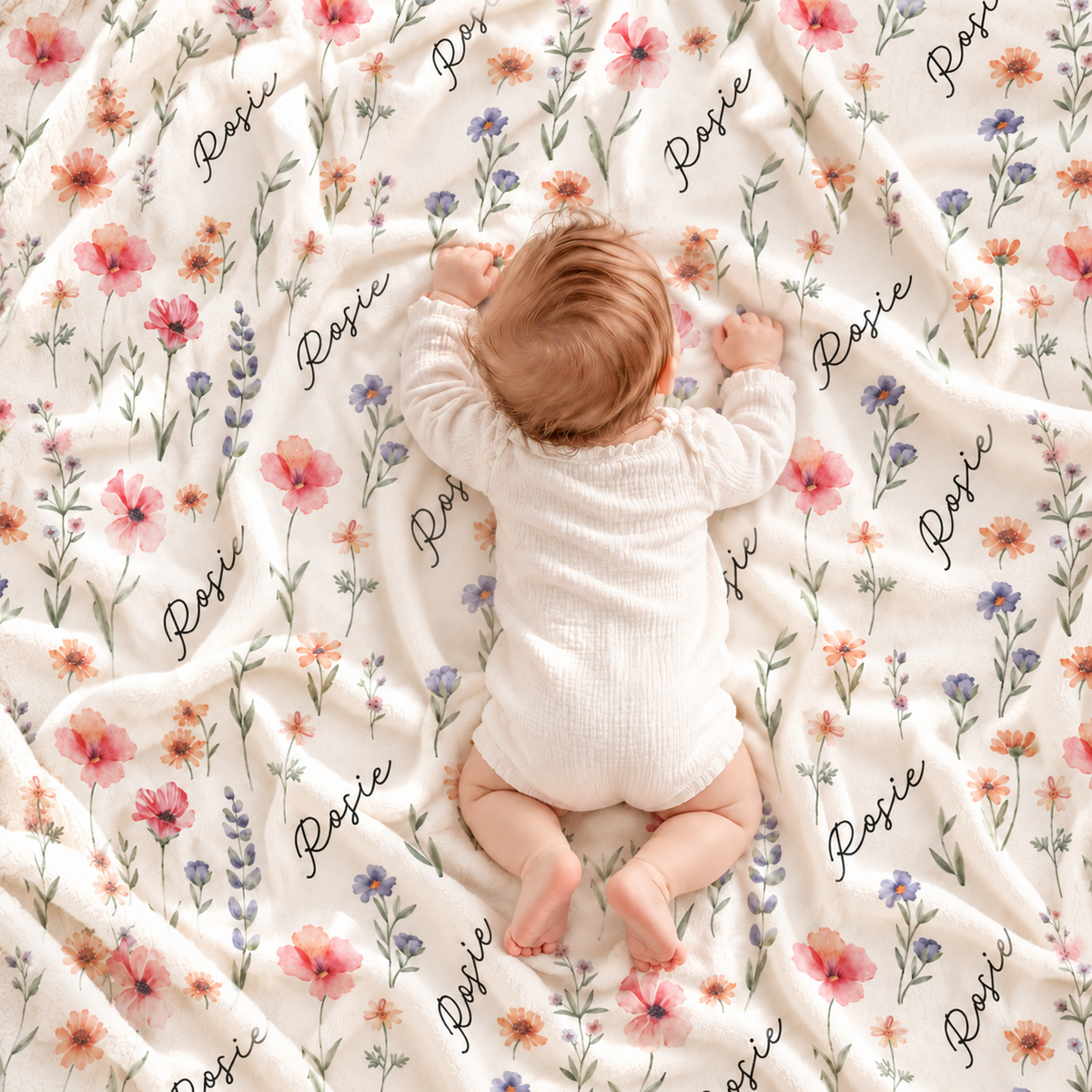 Baby on a personalized wildflower name blanket